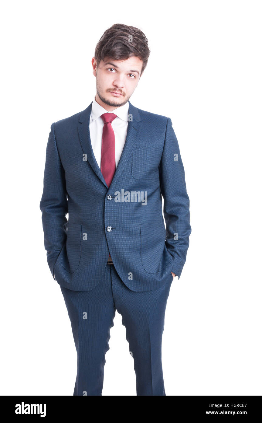Marketing manager standing with hands in pockets looking serious isolated on white background Stock Photo