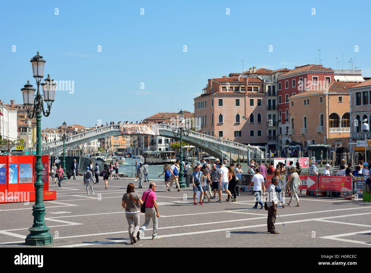 People before the Scalzi Bridge at the Grand Canal in Venice in Italy - Ponte degli Scalzi. Stock Photo