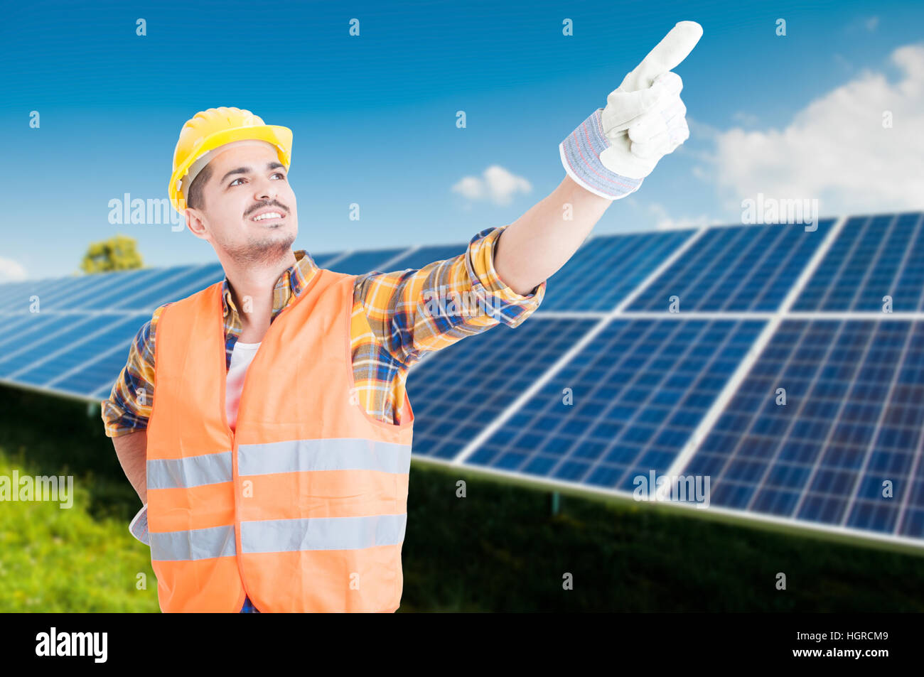 Young engineer pointing finger up and indicate something in ecologic ...