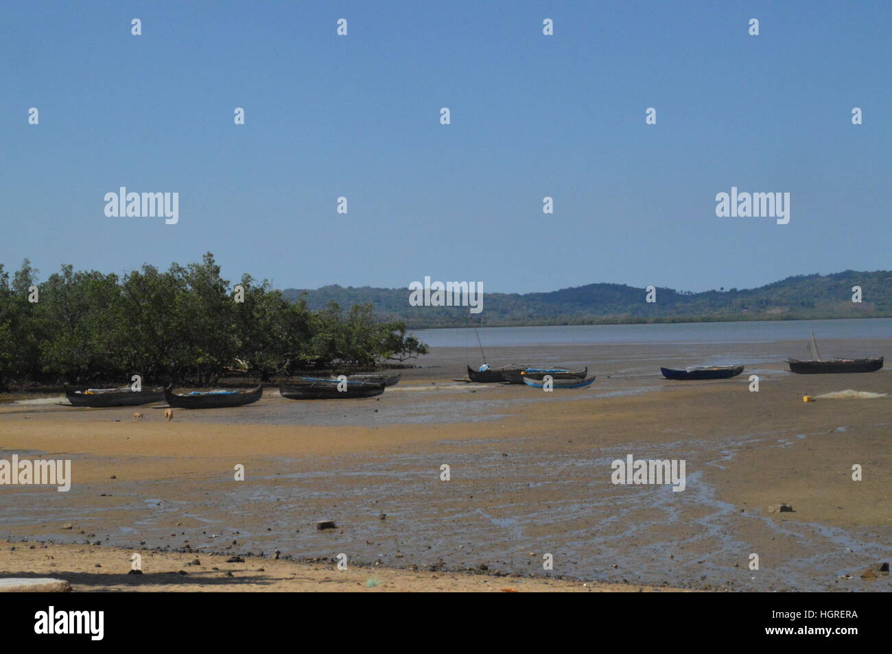 Pirogues lying idle on the shores of Ambatozavavay in Nosy Be, Madagascar Stock Photo