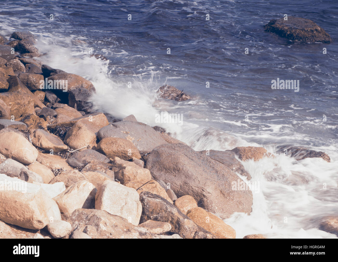 Waves splashing on rocks beach hi-res stock photography and images - Alamy