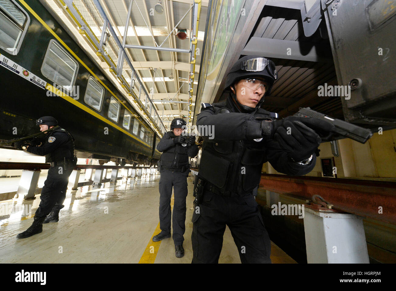 Beijing, China's Ningxia Hui Autonomous Region. 12th Jan, 2017. SWAT policement take part in an anti-riot exercise in a rail yard of the Yinchuan department of Lanzhou Railway Bureau in Yinchuan, capital of northwest China's Ningxia Hui Autonomous Region, Jan. 12, 2017. The exercise was held to improve security capacity for the upcoming Spring Festival travel rush. © Peng Zhaozhi/Xinhua/Alamy Live News Stock Photo