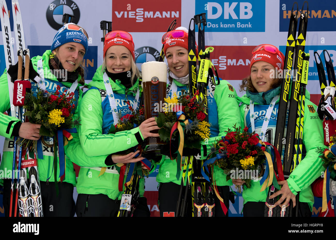 Ruhpolding, Germany. 12th Jan, 2017. L-R: German biathletes Vanessa Hinz, Maren Hammerschmidt, Franziska Preuss and Laura Dahlmeier on the victor's podium after taking first place in the 4 x 6 kilometer women's relay race at the Biathlon World Cup in the Chiemgau Arena in Ruhpolding, Germany, 12 January 2017. Germany finished in first place ahead of France and Norway. Photo: Matthias Balk/dpa/Alamy Live News Stock Photo