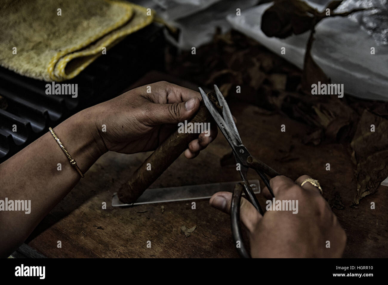 January 6, 2017 - Surabaya, East Java, Indonesia - EAST JAVA, INDONESIA - JANUARY 12 : Indonesian workers handrolling clove cigarettes at Cigarettes factory on January 06, 2017 in Surabaya, East Java, Indonesia. Indonesia is world largets cigarettes produce. (Credit Image: © Sijori Images via ZUMA Wire) Stock Photo