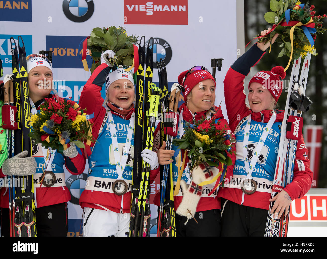 Ruhpolding, Germany. 12th Jan, 2017. L-R: Norwegian biathletes Kaia Woeien Nicolaisen, Hilde Fenne, Tiril Eckhoff and Marte Olsbu on the victors' podium after competing in the 4 x 6 kilometer women's relay race at the Biathlon World Cup in the Chiemgau Arena in Ruhpolding, Germany, 12 January 2017. Germany finished in first place ahead of France and Norway. Photo: Matthias Balk/dpa/Alamy Live News Stock Photo