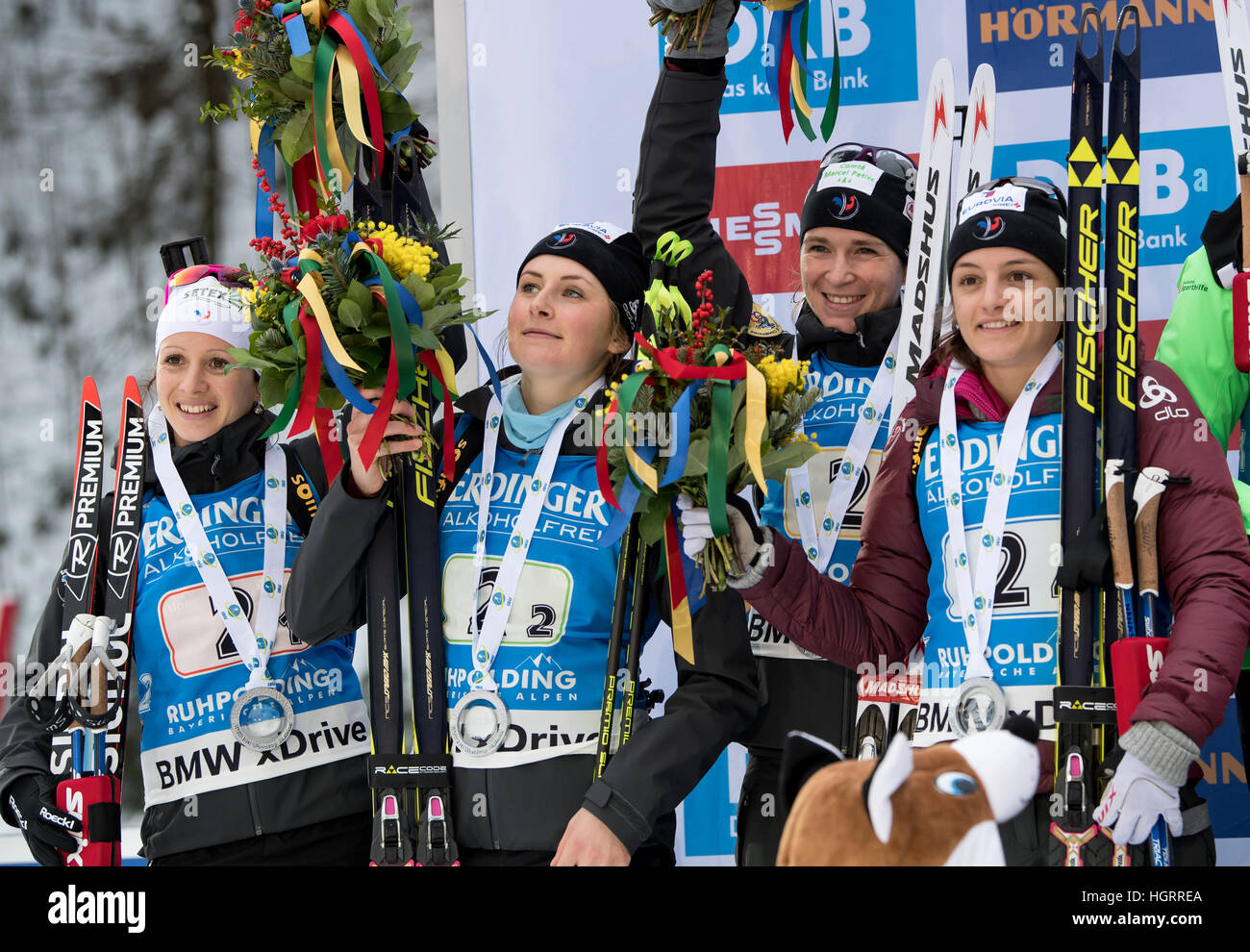 Ruhpolding, Germany. 12th Jan, 2017. L-R: French biathletes Anais Chevalier, Justine Braisaz, Anais Bescond and Celia Aymonier on the victors' podium after competing in the 4 x 6 kilometer women's relay race at the Biathlon World Cup in the Chiemgau Arena in Ruhpolding, Germany, 12 January 2017. Germany finished in first place ahead of France and Norway. Photo: Matthias Balk/dpa/Alamy Live News Stock Photo