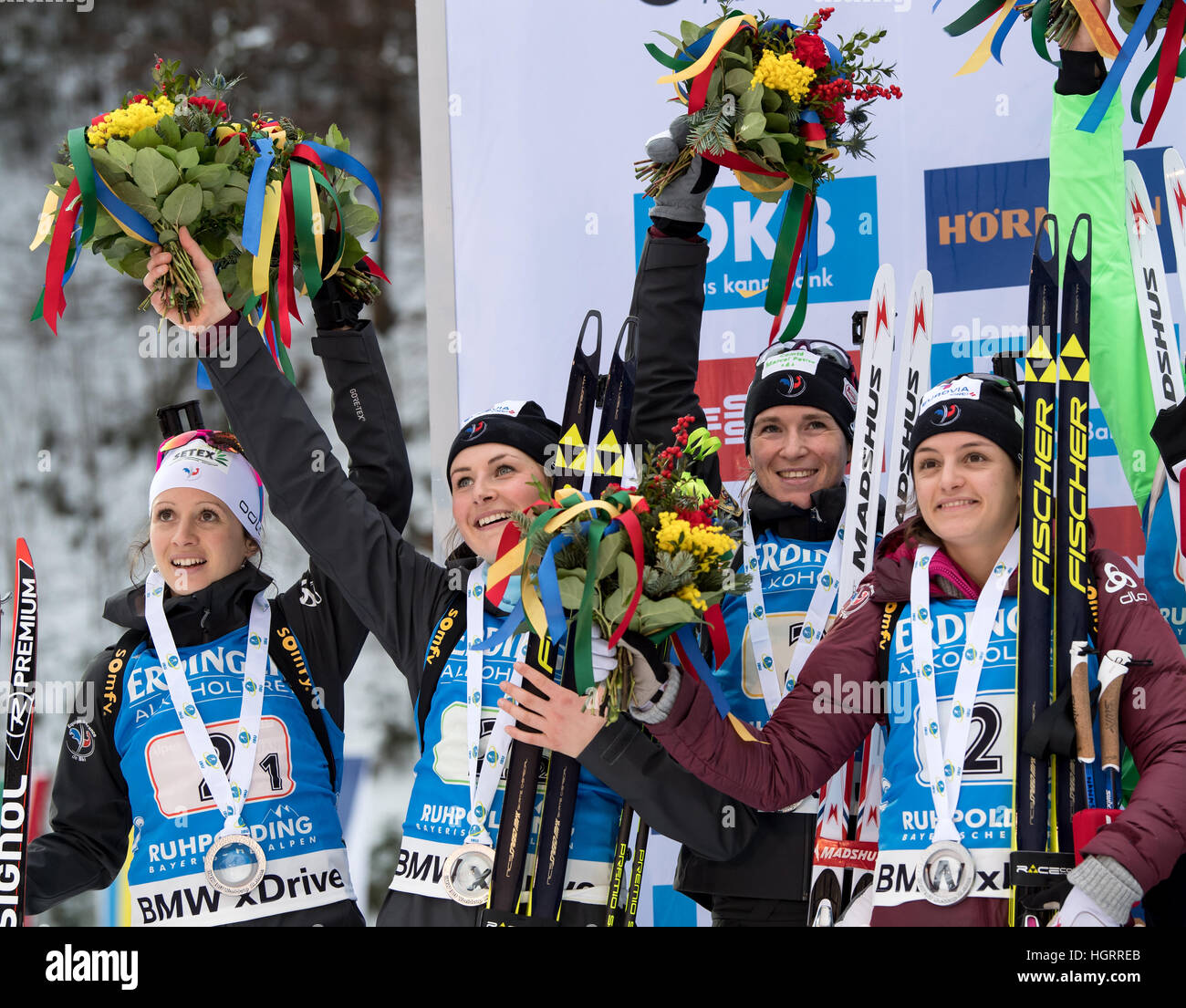 Ruhpolding, Germany. 12th Jan, 2017. L-R: French biathletes Anais Chevalier, Justine Braisaz, Anais Bescond and Celia Aymonier on the victors' podium after competing in the 4 x 6 kilometer women's relay race at the Biathlon World Cup in the Chiemgau Arena in Ruhpolding, Germany, 12 January 2017. Germany finished in first place ahead of France and Norway. Photo: Matthias Balk/dpa/Alamy Live News Stock Photo