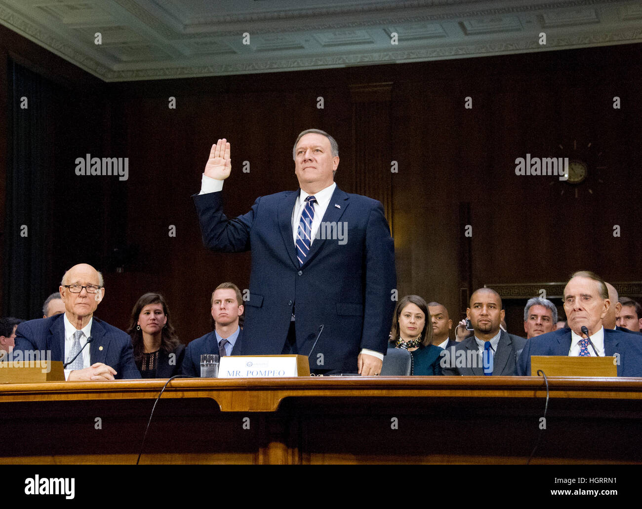 Washington DC, USA. 12th January 2017. United States Representative Mike Pompeo (Republican of Kansas) is sworn-in to testify before the US Senate Select Committee on Intelligence during a confirmation hearing on his nomination to be Director of the Central Intelligence Agency (CIA) on Capitol Hill in Washington, DC on Thursday, January 12, 2017. US Senator Pat Roberts (Republican of Kansas), left, and former US Senate Majority Leader Bob Dole (Republican of Kansas), right, look on from the witness table. Credit: MediaPunch Inc/Alamy Live News Stock Photo