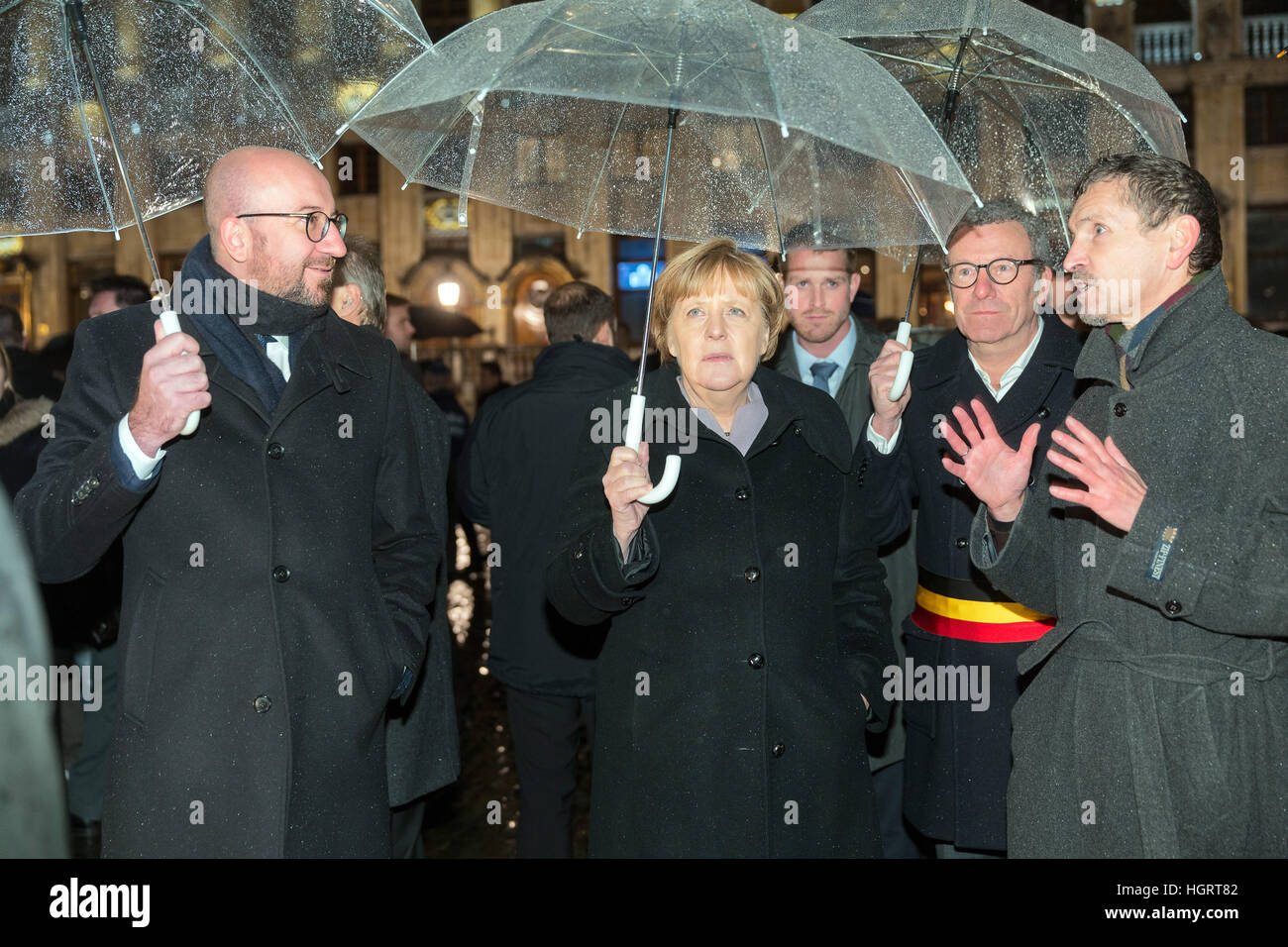 Brussels, Belgium. 12th Jan, 2017. The German Chancellor Angela Merkel (CDU) with the Belgian Prime Minister Charles Michel (L) and the Mayor of Brussels Yvan Mayeur (2-R) in front of the Grand Palace in Brussels, Belgium, 12 January 2017. Photo: Thierry Monasse/dpa/Alamy Live News Stock Photo
