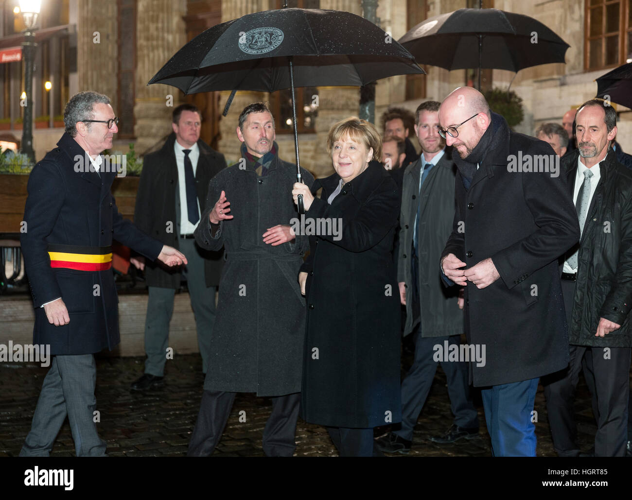 Brussels, Belgium. 12th Jan, 2017. The German Chancellor Angela Merkel (CDU) with the Belgian Prime Minister Charles Michel (2-R) and the Mayor of Brussels Yvan Mayeur (L) in front of the Grand Palace in Brussels, Belgium, 12 January 2017. Photo: Thierry Monasse/dpa/Alamy Live News Stock Photo