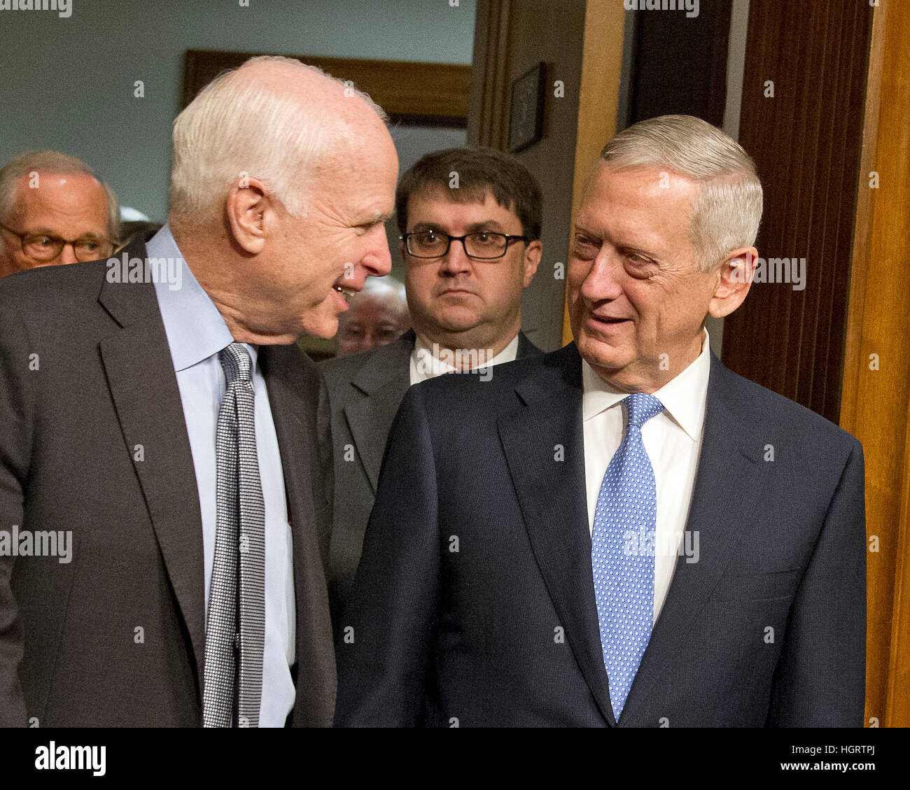 Washington DC, USA. 12th January 2017. United States Senator John McCain (Republican of Arizona), Chairman, US Senate Committee on Armed Services, left, escorts US Marine Corps General James N. Mattis (retired), right, into the room as committee holds a confirmation hearing on Mattis' nomination to be Secretary of Defense on Capitol Hill in Washington, DC on Thursday, January 12, 2017. Credit: MediaPunch Inc/Alamy Live News Stock Photo