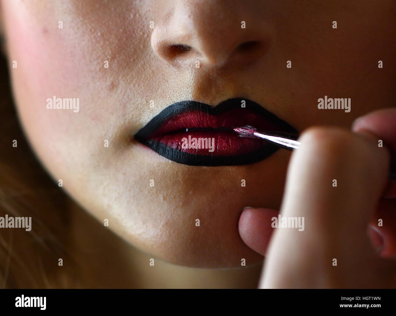 Berlin, Germany. 13th Jan, 2017. Model Lara receives her make-up during ...