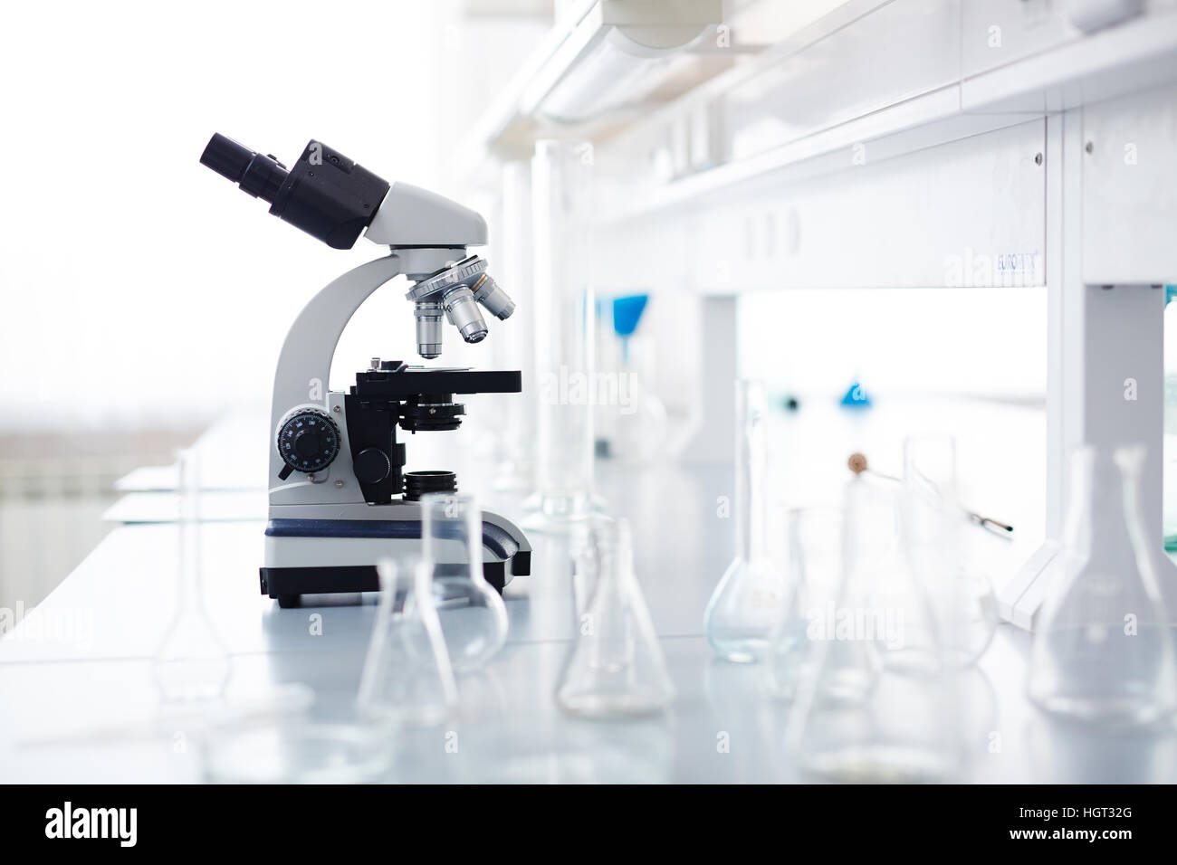Workplace of microbiologist with microscope and empty tubes Stock Photo ...