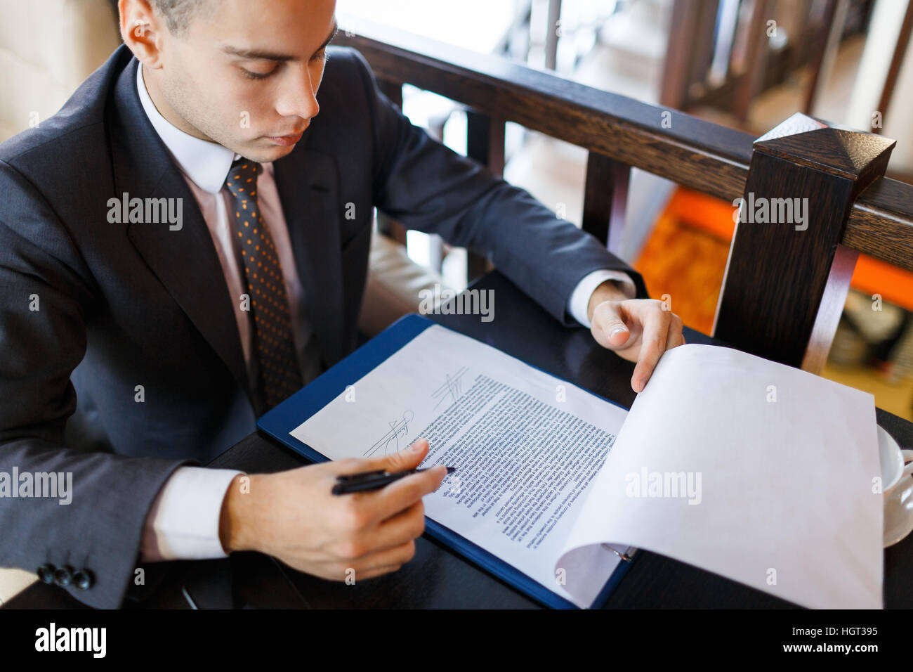 Reading before signing hi-res stock photography and images - Alamy
