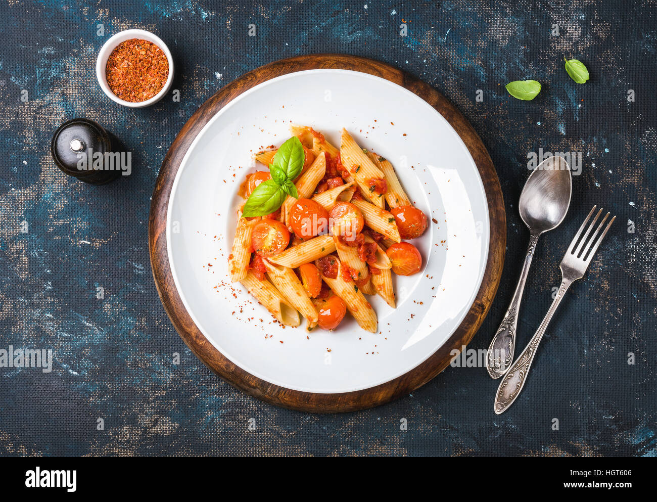 Pasta penne with tomato sauce, fresh basil and roasted tomatoes Stock