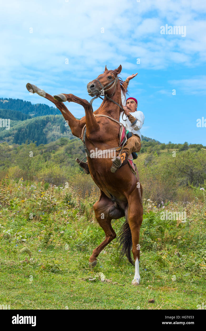Man on a rearing horse, Kazakh ethnographical village Aul Gunny, Talgar city, Almaty, Kazakhstan, Central Asia, For editorial Use only Stock Photo