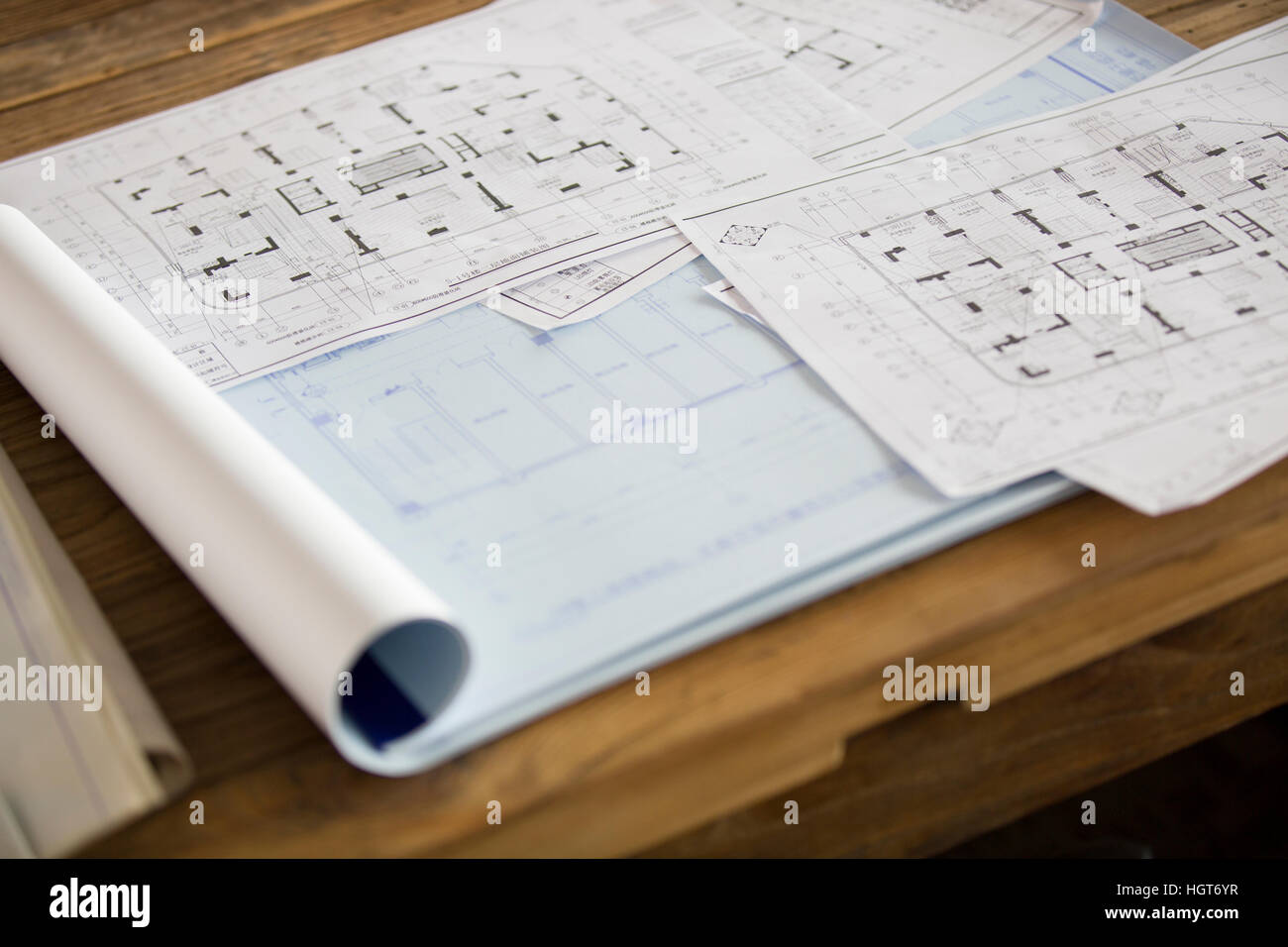 Blueprints on office desk Stock Photo Alamy