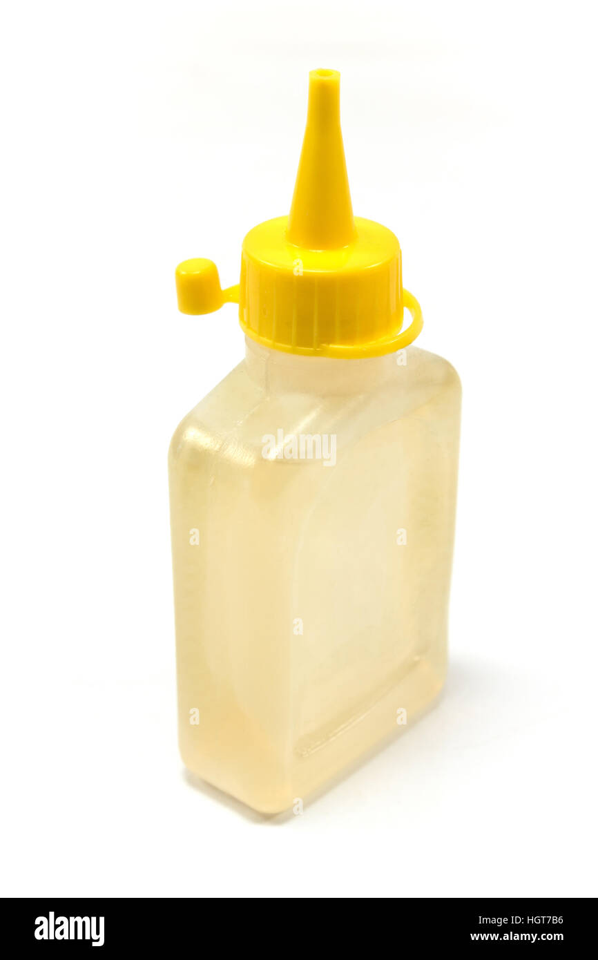 Bottle of lubricating machine oil isolated on white Stock Photo