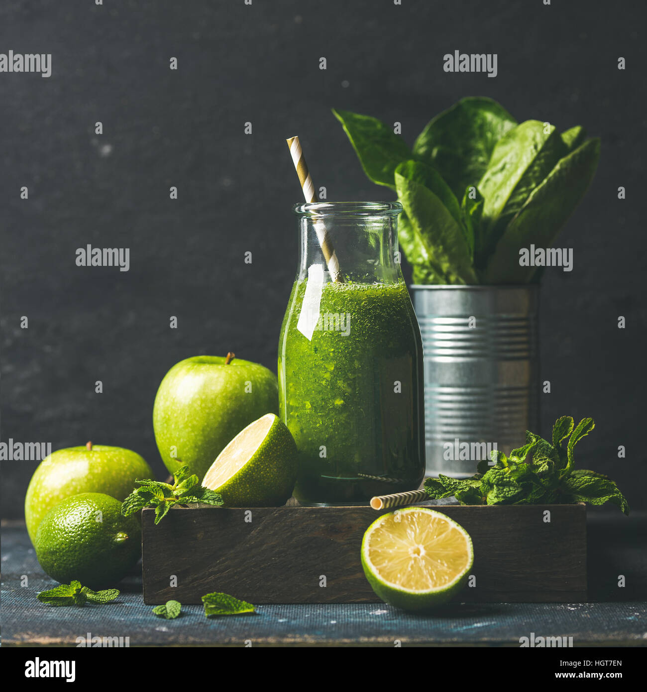 Green smoothie with apple, romaine lettuce, lime, mint. Dark background Stock Photo