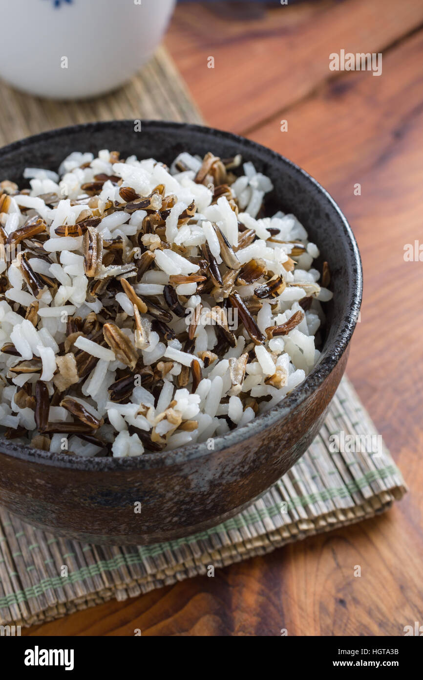 Mix of cooked native North American Indian wild rice and boiled long grain rice Stock Photo