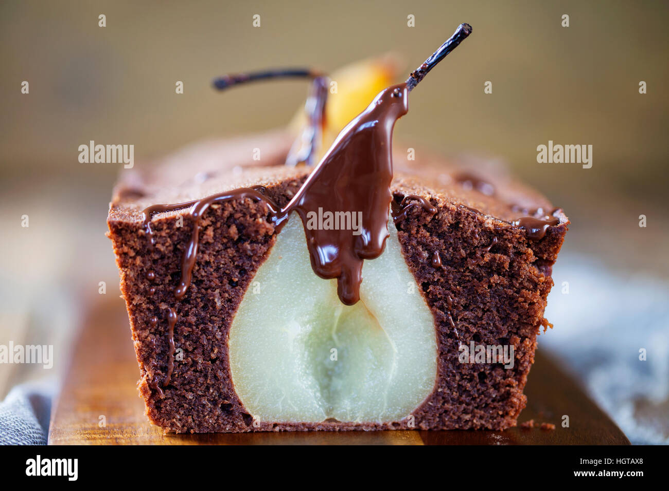 Chocolate sponge cake with poached pear Stock Photo