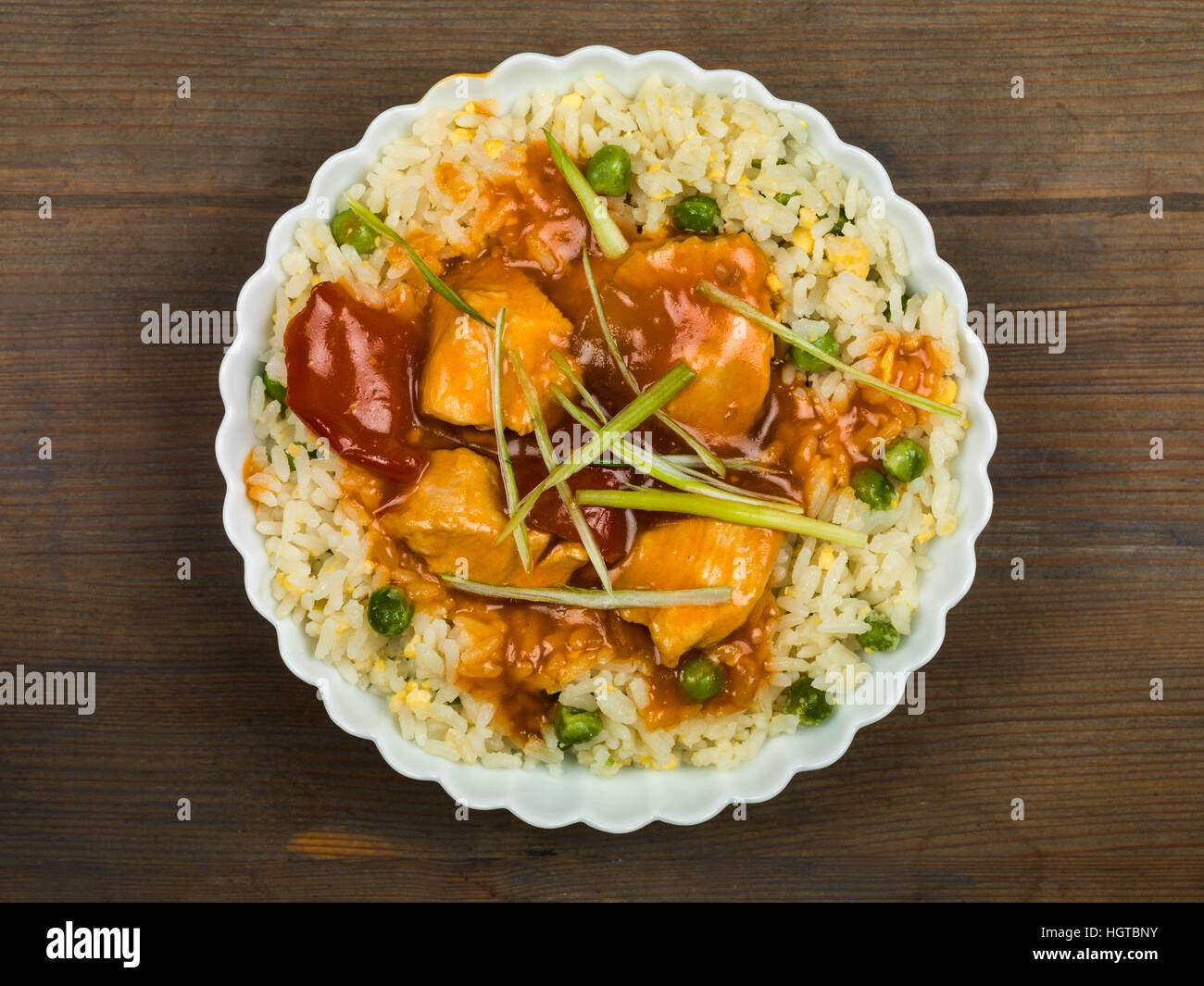 Chinese Sweet and Sour Chicken With Egg Fried Rice Meal Stock Photo