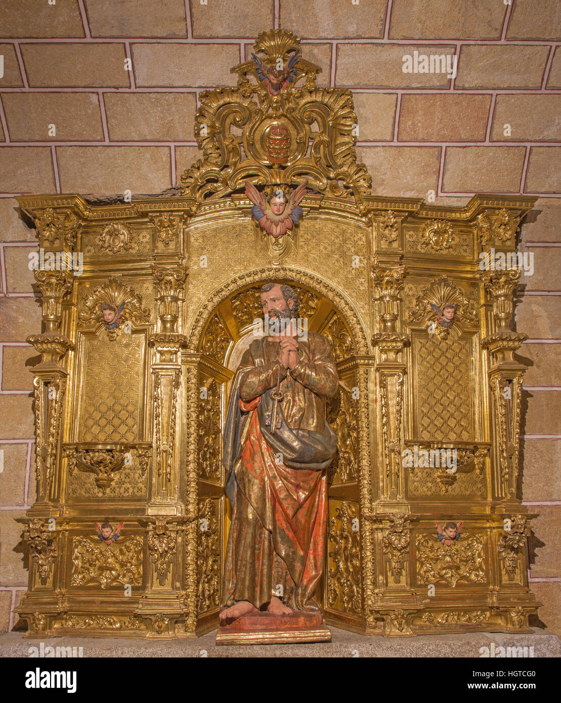 AVILA, SPAIN, APRIL - 19, 2016: The carved polychrome baroque altar of St. Peter in church Basilica de San Vicente. Stock Photo