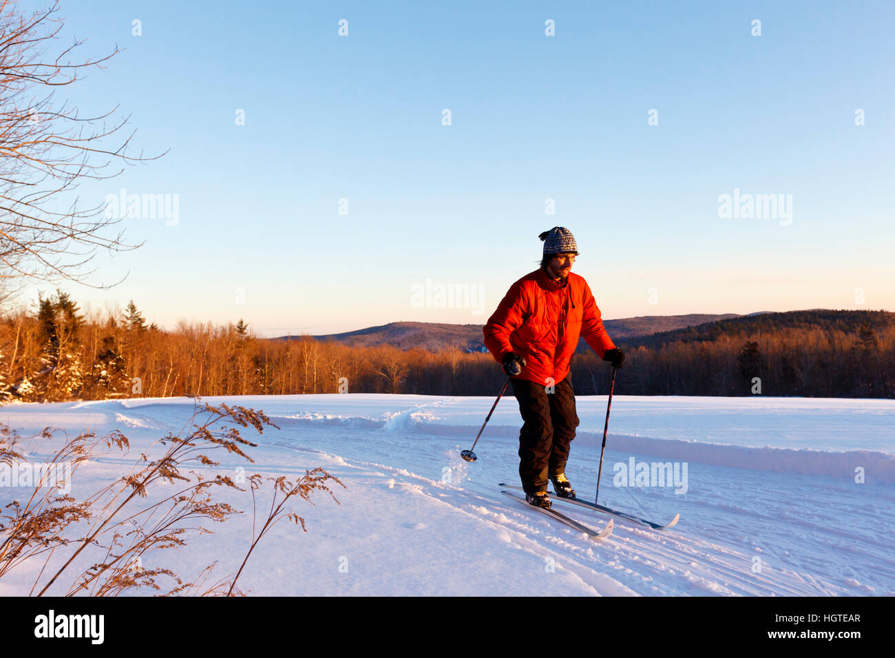 A man crosscountry skiing in a field at the Notchview Reservation in