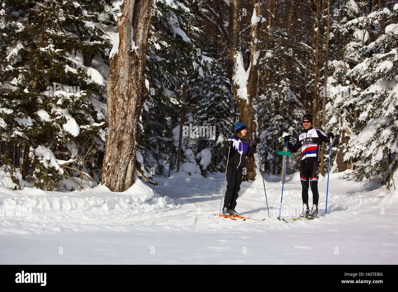 A man and woman crosscountry skiing at the Notchview Reservation in