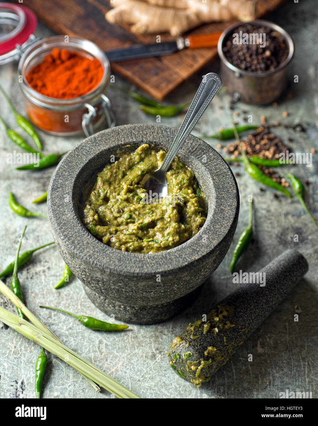 A delicious Thai green curry paste with mortar and pestle. Stock Photo
