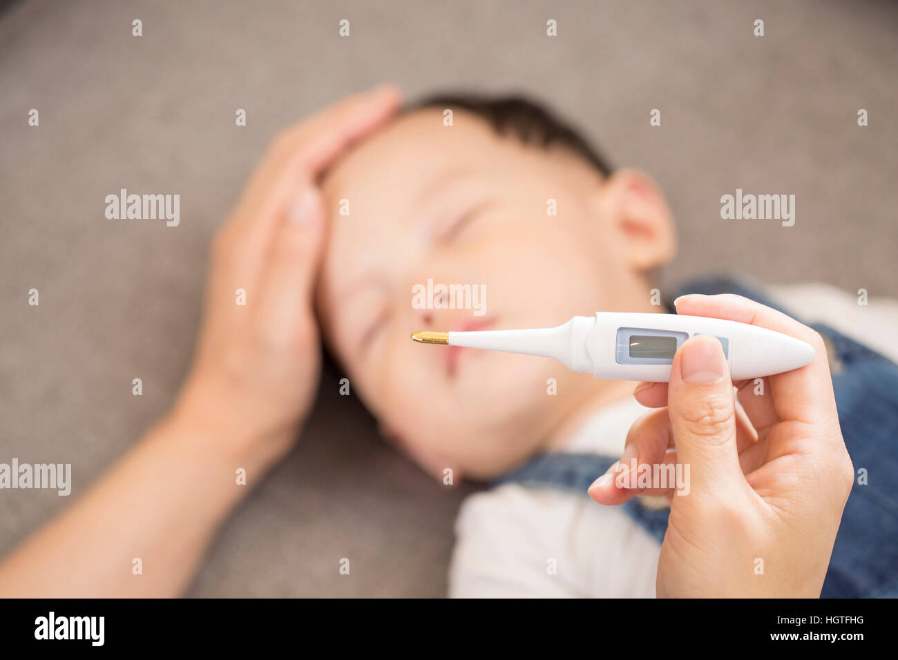 Mother taking care of her sick baby Stock Photo