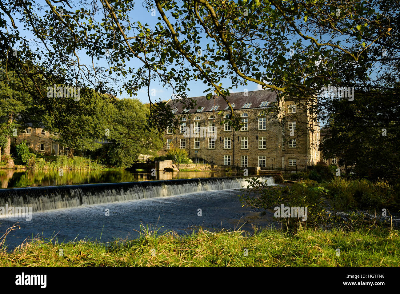 Former cotton mill on the river Derwent converted to flats Derbyshire