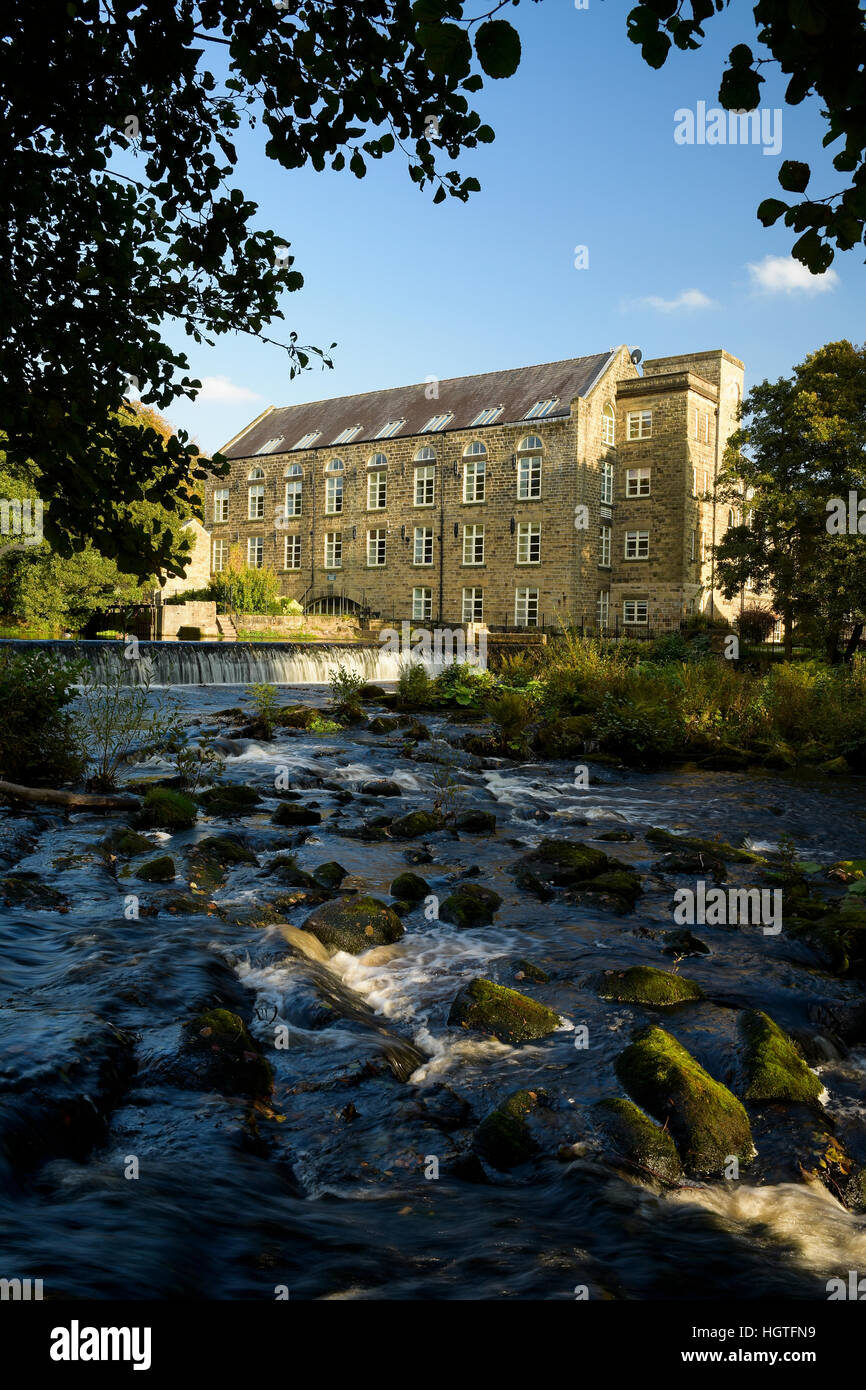 Former cotton mill on the river Derwent converted to flats Derbyshire