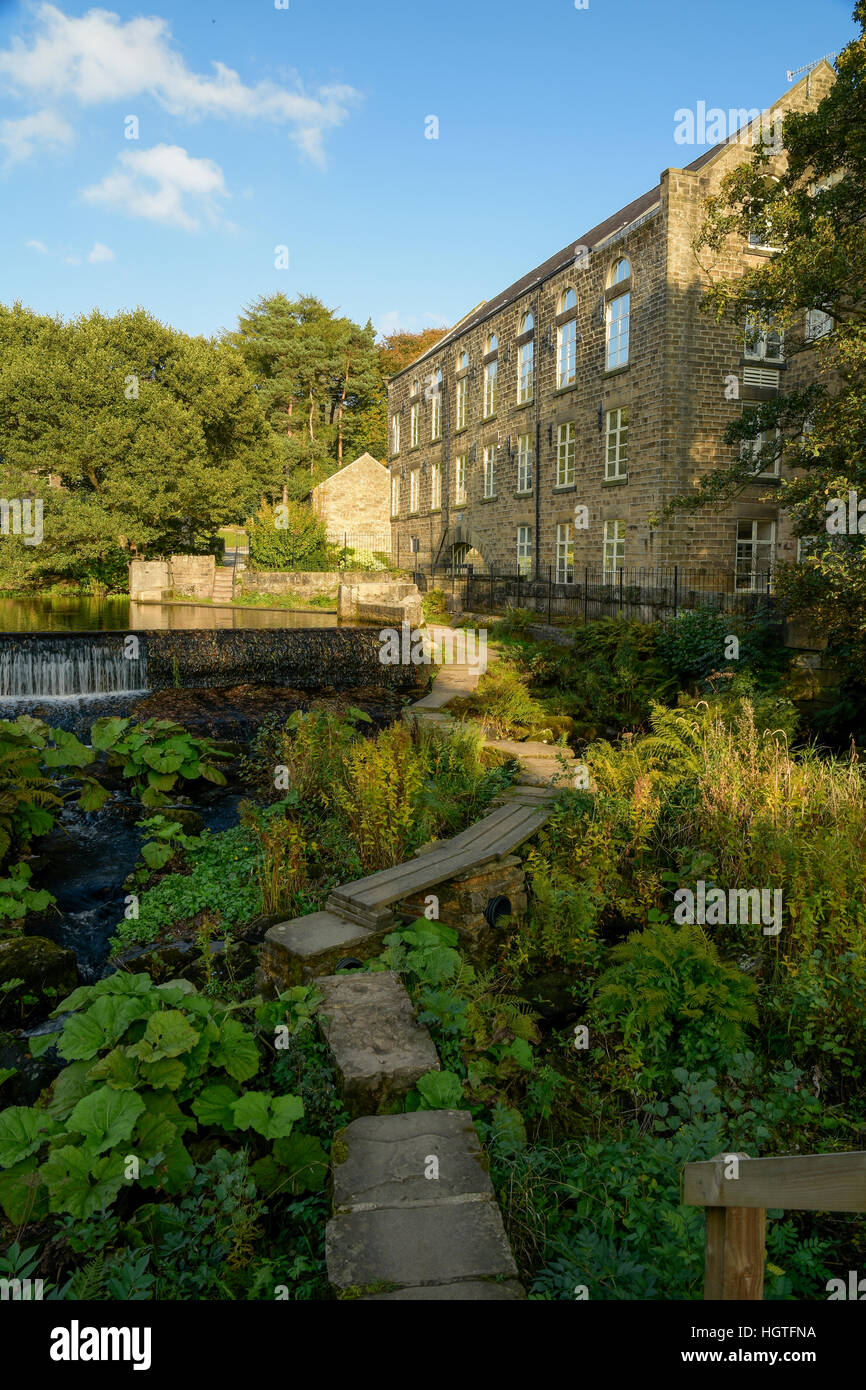 Former cotton mill on the river Derwent converted to flats Derbyshire