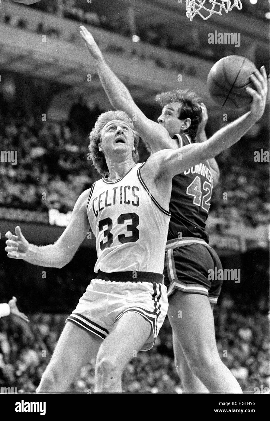 Boston Celtics Larry Bird scores past Buck's Terry Cumings in game action at the Boston garden in Boston Mass 1986 season photo by Bill Belknap Stock Photo