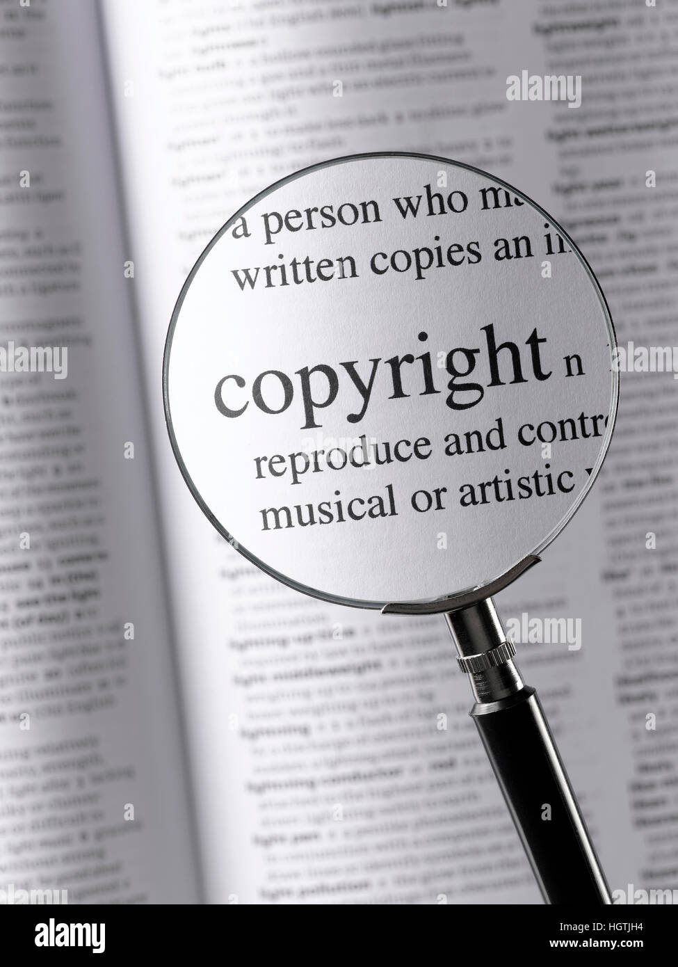 Magnifying Glass Highlighting Copyright Stock Photo