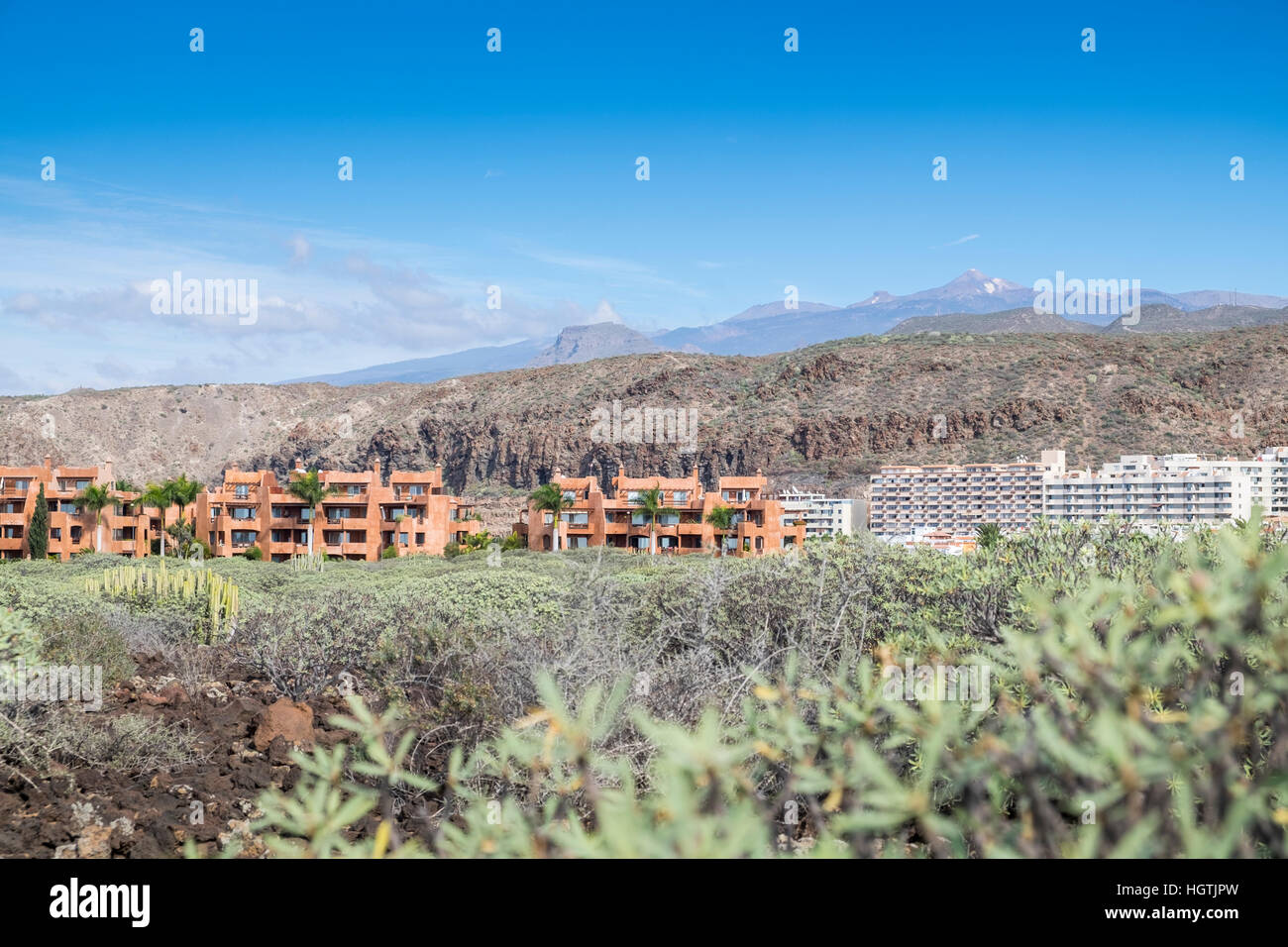 El Palm Mar urbanization at the base of Guaza mountain next to the coast in Tenerife, Canary Islands, Spain Stock Photo