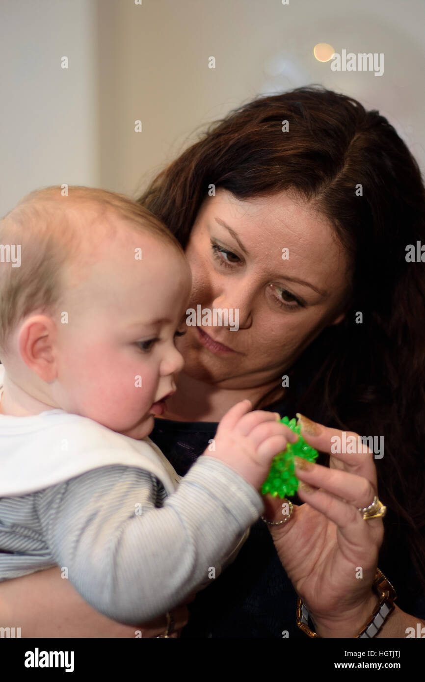 mother and baby , nursery worker and child Stock Photo Alamy
