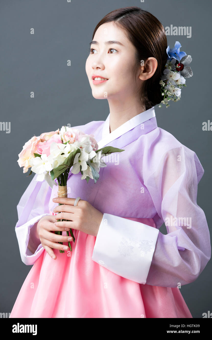 Side View Of Smiling Woman In Traditional Korean Clothes Stock
