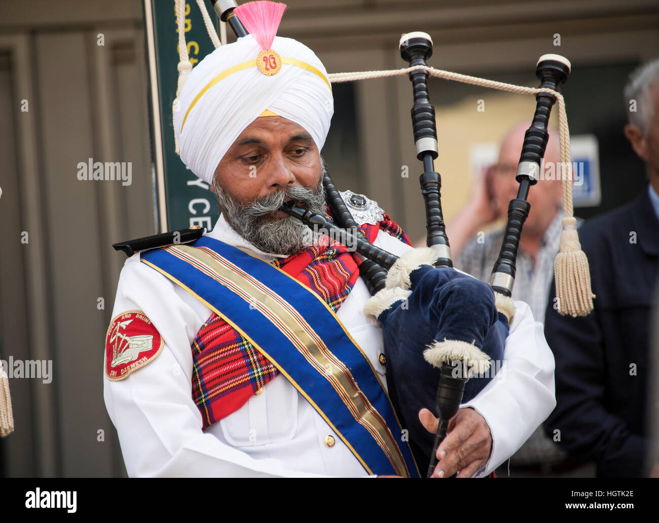 Member of  the Sri Dasmesh Pipe Band of  Malaysian performing in Glasgow. Stock Photo