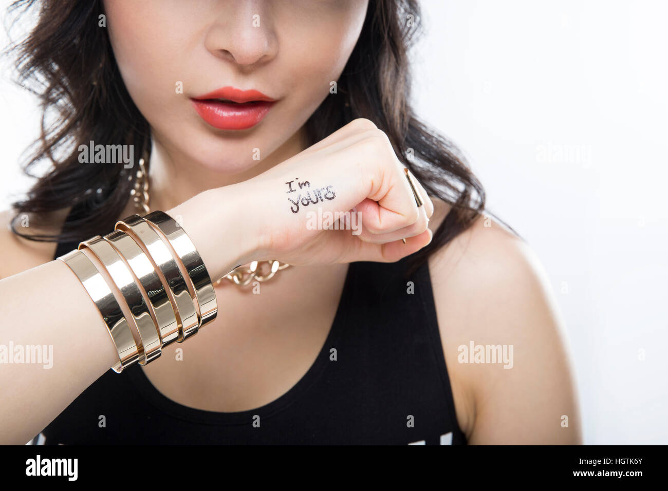 Woman wearing black sleeveless top hi-res stock photography and images ...