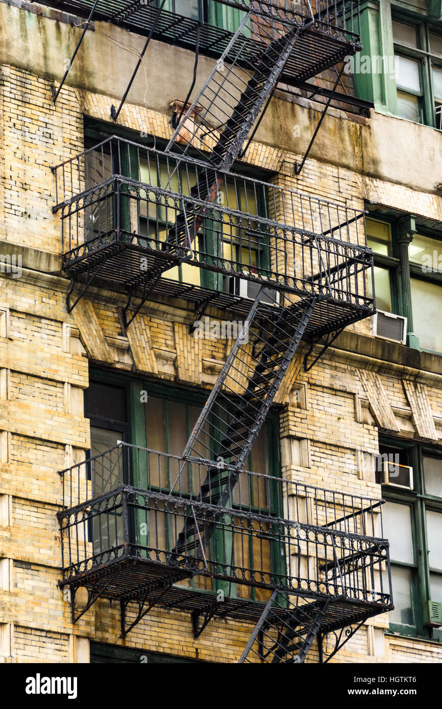 Abstract view of fire escape ladders on the side of a New York building Stock Photo