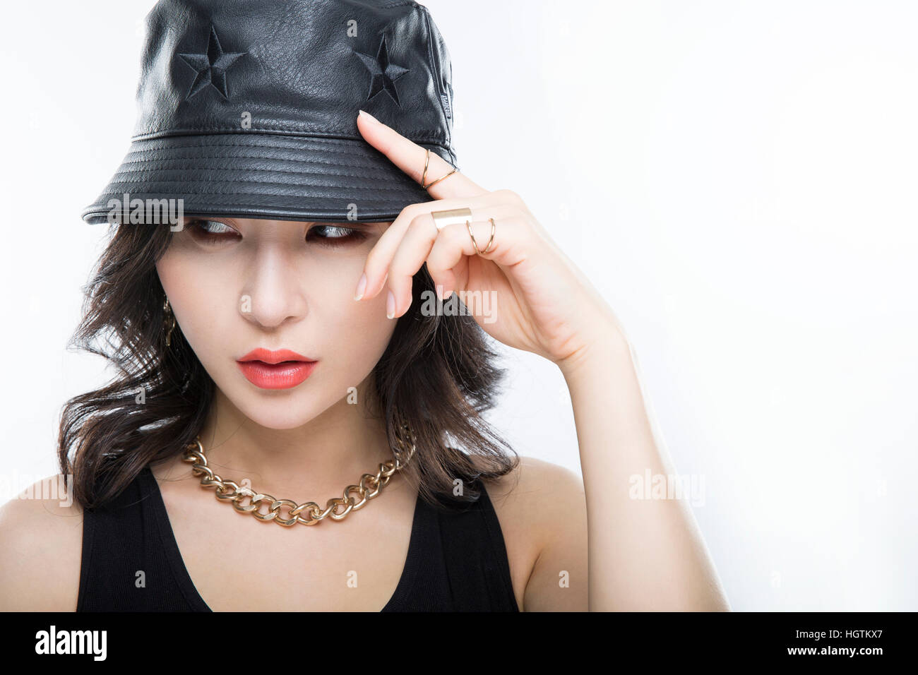 Portrait of young woman in black hat Stock Photo - Alamy