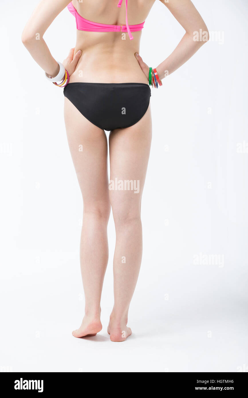 Back of young slim woman's body part in bikini Stock Photo