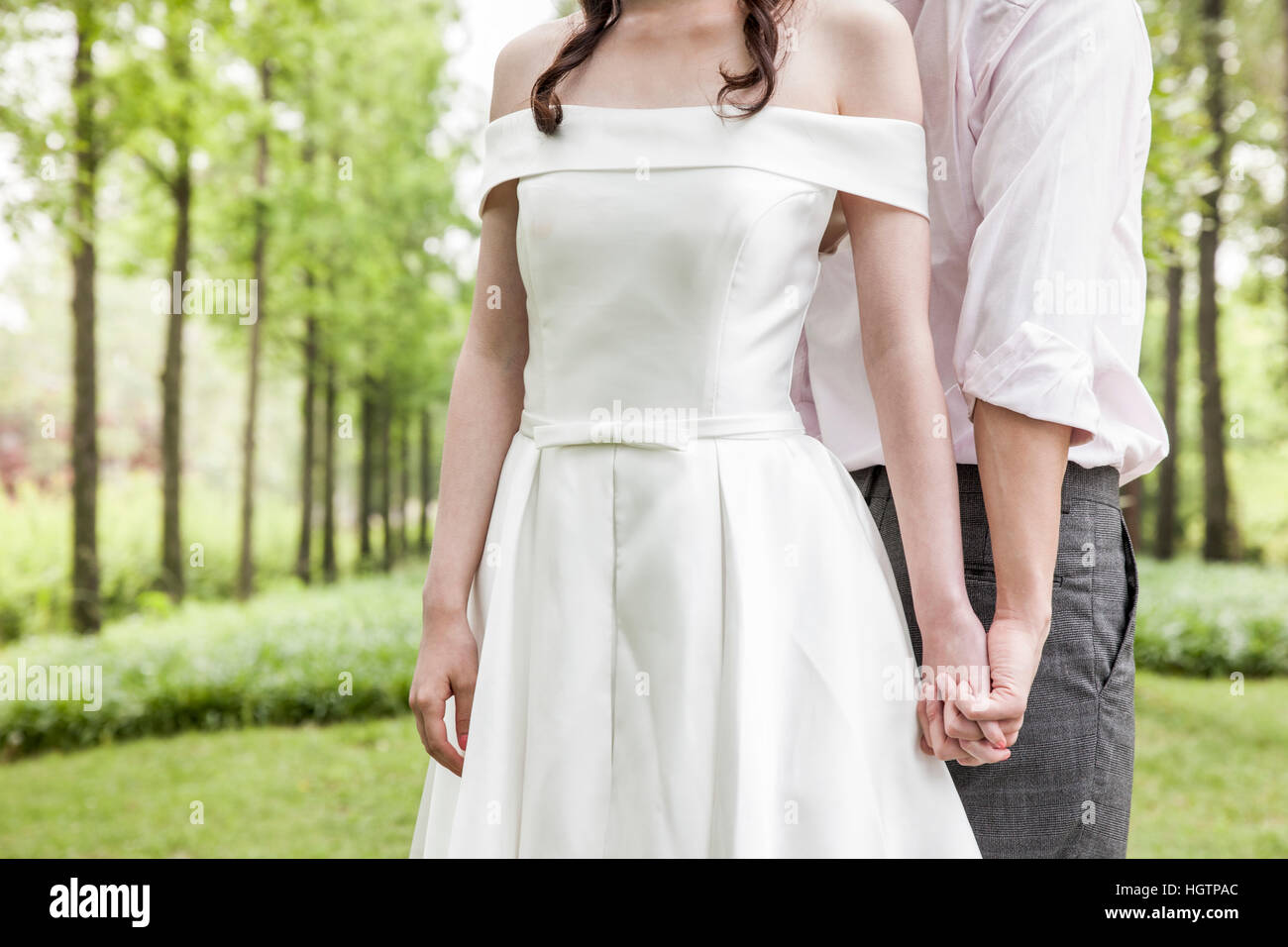 Young Wedding Couple Posing Outdoors Stock Photo Alamy