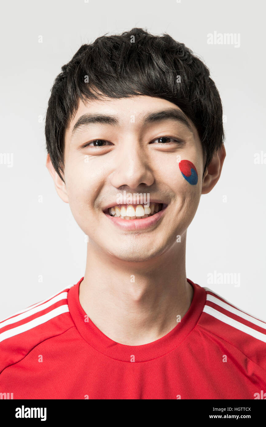 Portrait of young smiling.Korean cheerleader man Stock Photo