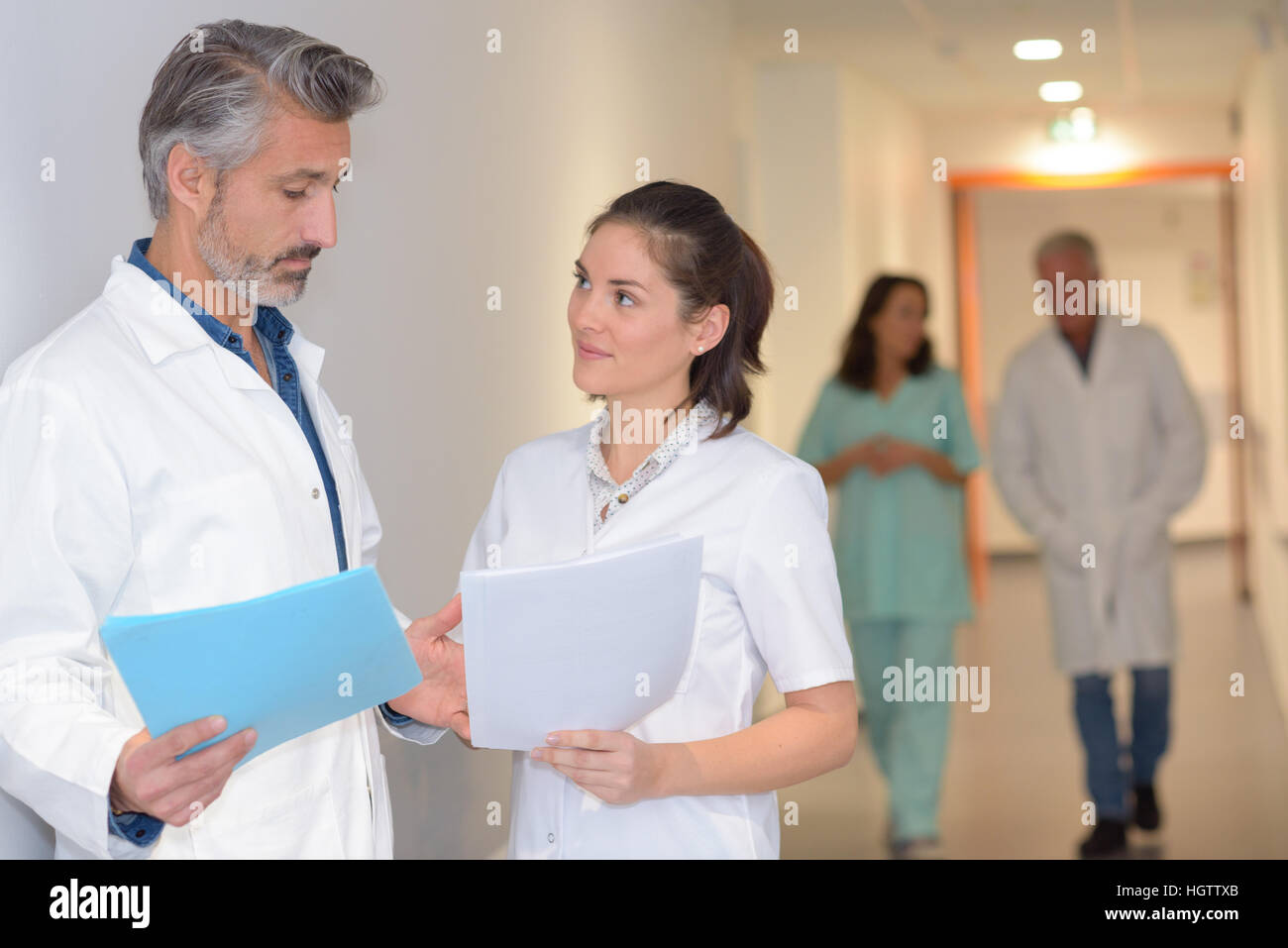 Medical team discussing notes hi-res stock photography and images - Alamy
