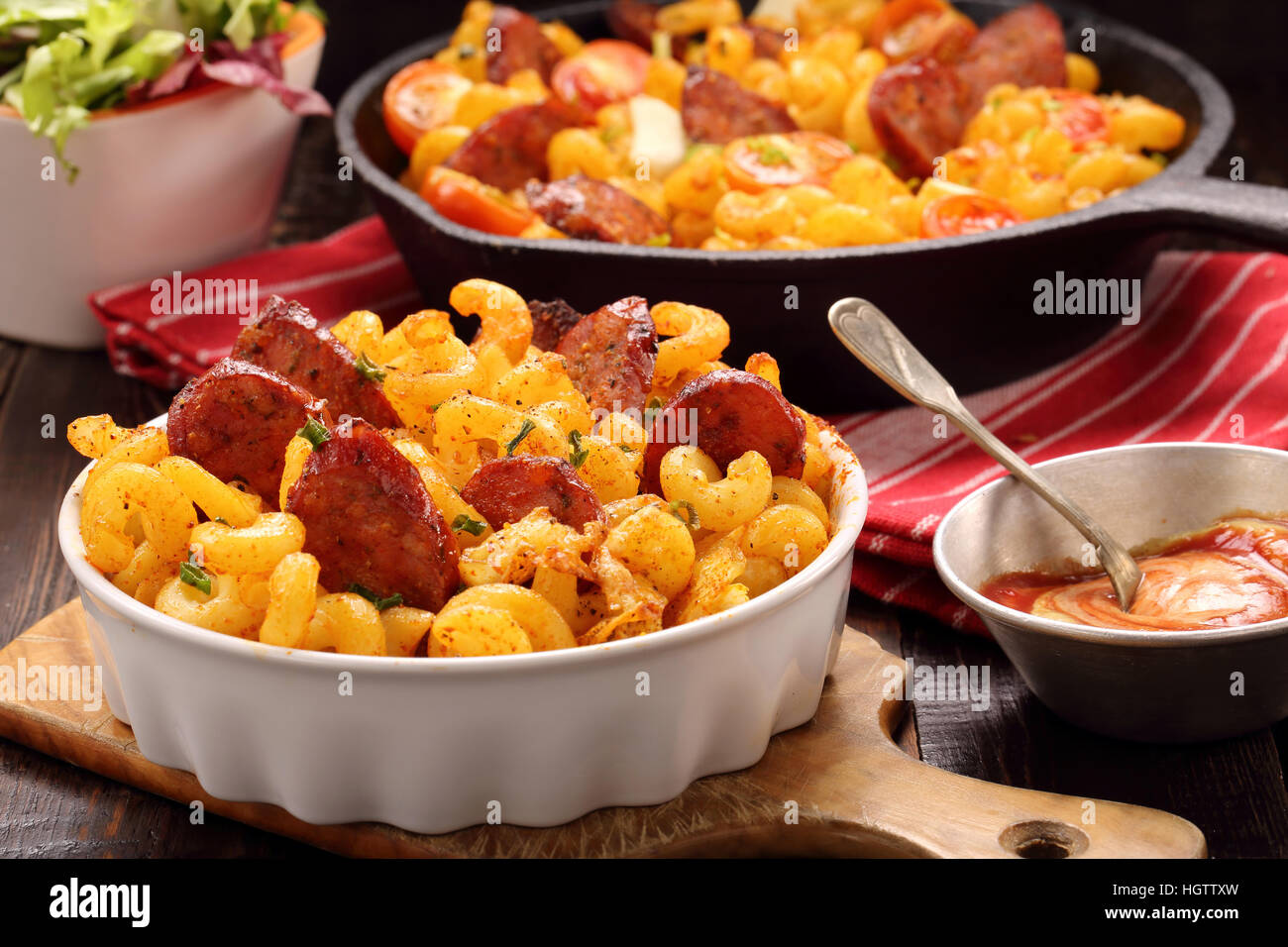 Casserole with chorizo sausage on wooden background Stock Photo Alamy