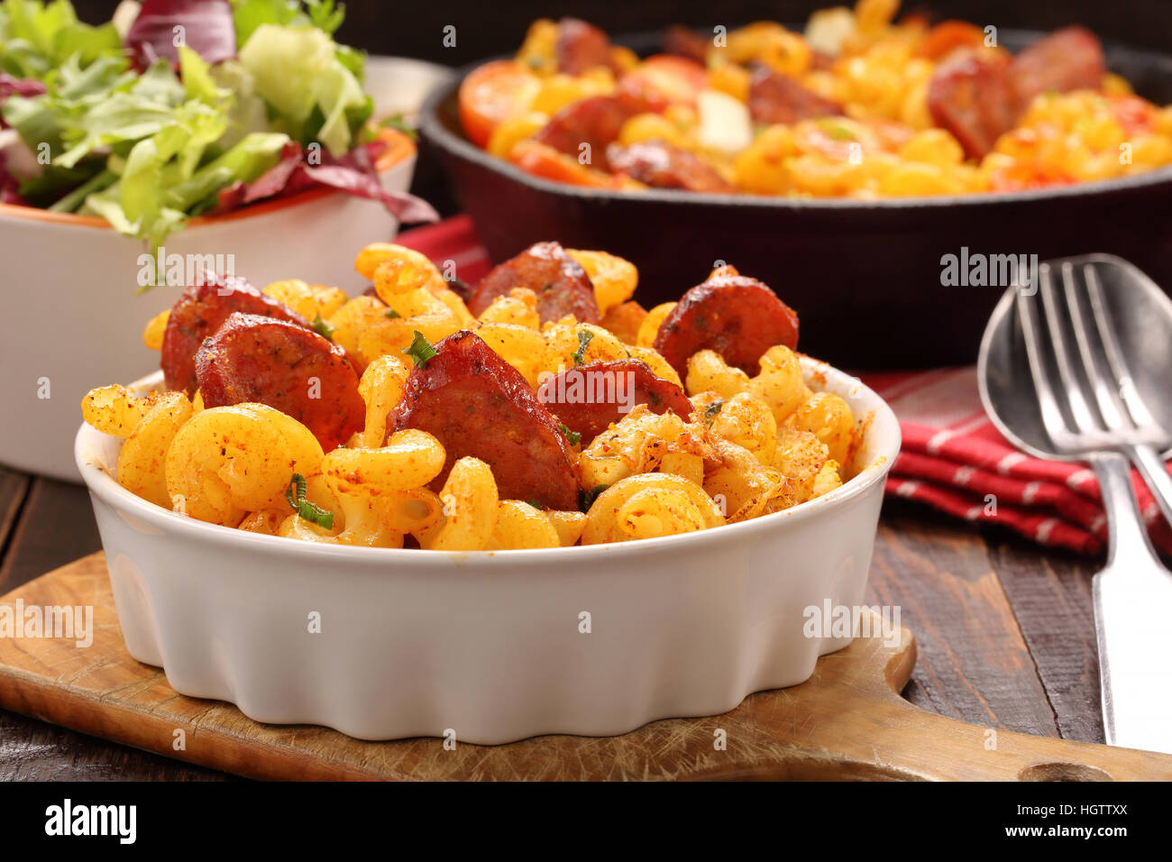 Casserole with chorizo sausage on wooden background Stock Photo Alamy