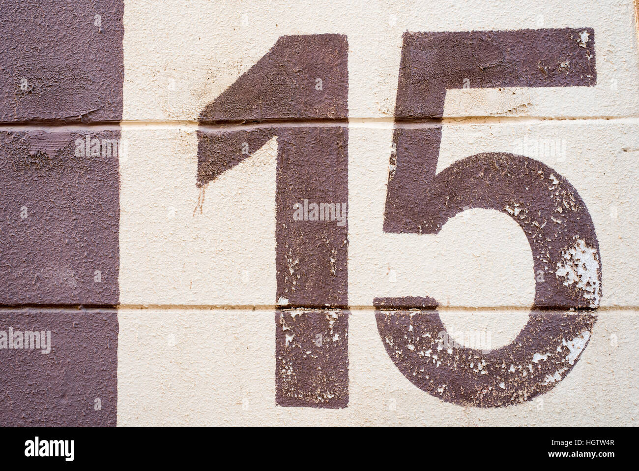 Number fifteen texture on wall Stock Photo